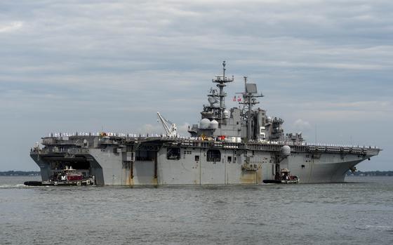 NORFOLK, Va. - The amphibious assault ship USS Bataan (LHD 5) departs ...