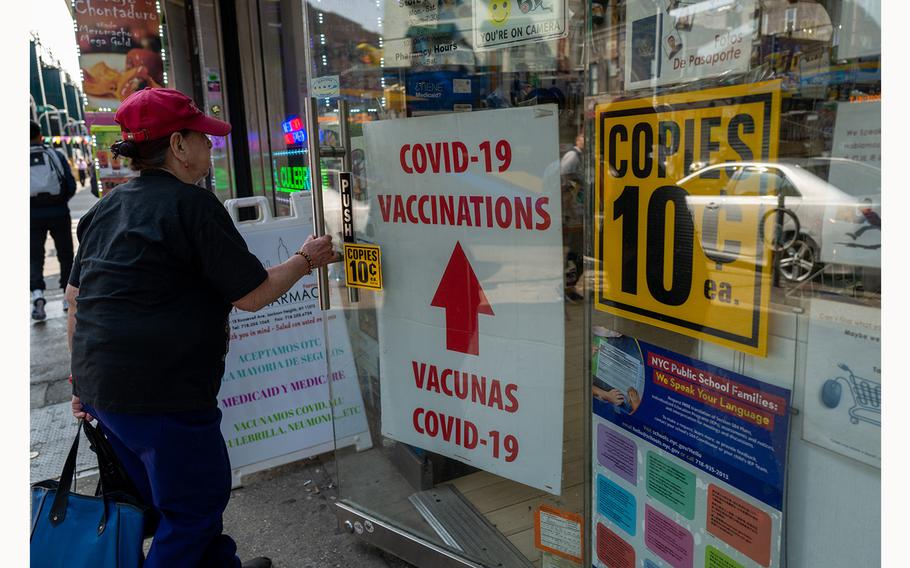 A pharmacy advertises COVID-19 vaccines in a window in the Queens borough of New York City on May 11, 2023.