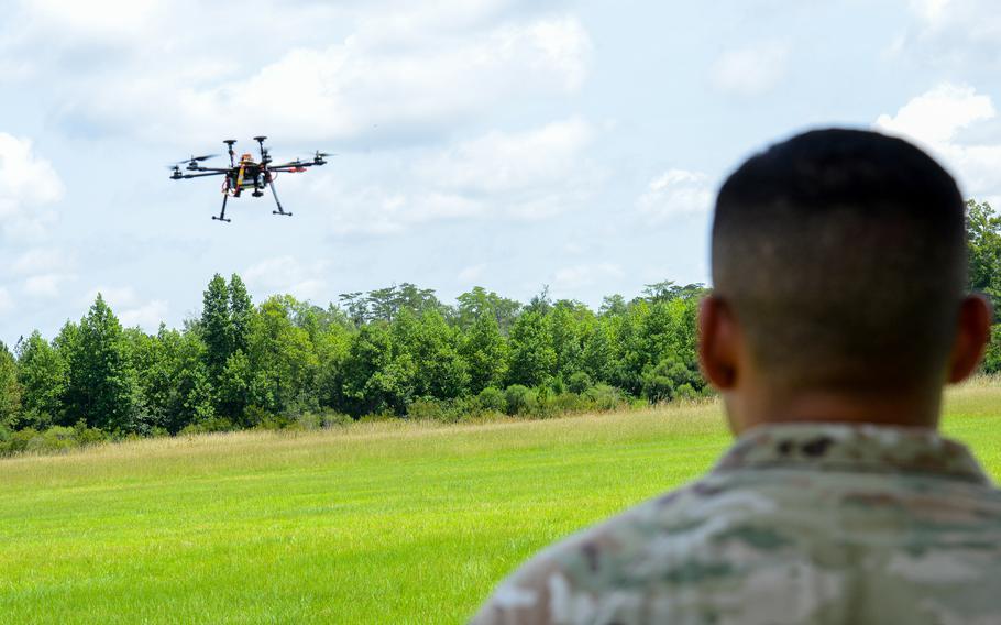 A 3rd Infantry Division soldier watches as a small drone built in a drone-building class at Fort Stewart, Ga., flies over a small airfield just off the Army post on July 26, 2024. 