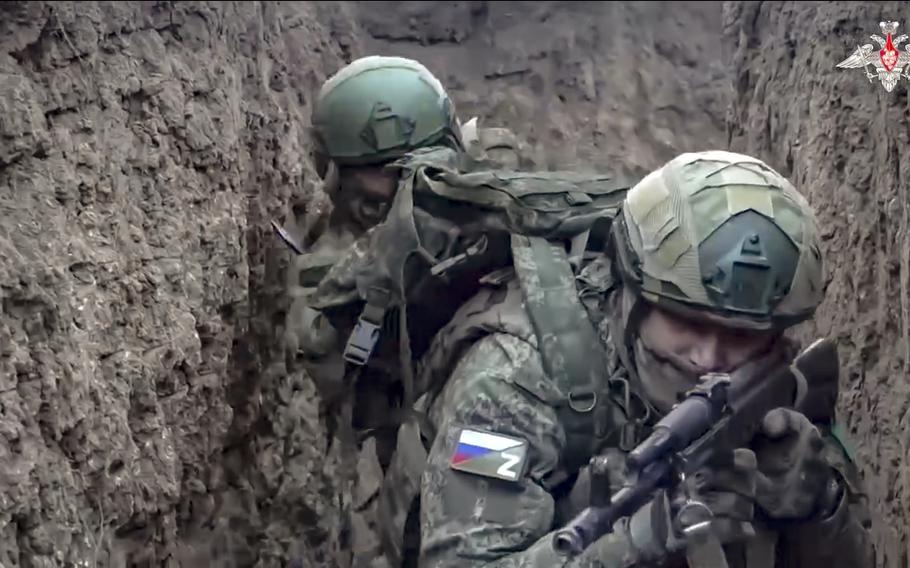 Russian servicemen attend a combat training for assault units.