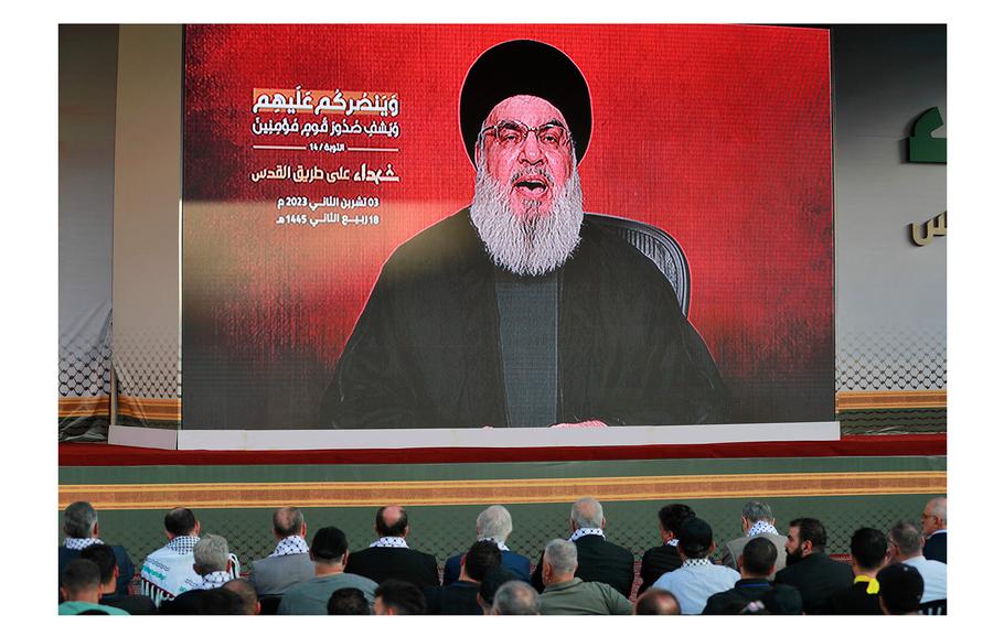 Supporters of the Lebanese Shiite movement Hezbollah watch a televised speech by its leader, Hassan Nasrallah, in the Lebanese capital Beirut's southern suburbs on Friday, Nov. 3, 2023. 