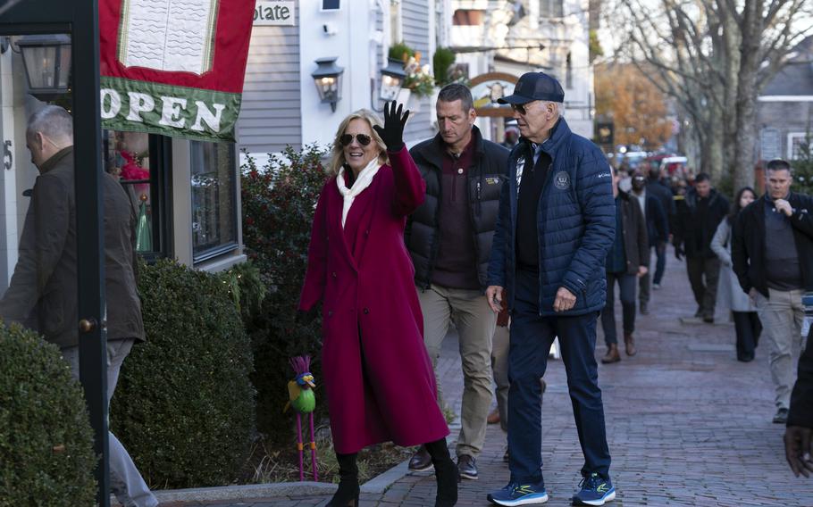 President Joe Biden, right, and first lady Jill Biden visit shops as they walk in downtown Nantucket Mass., Friday, Nov. 29, 2024. 