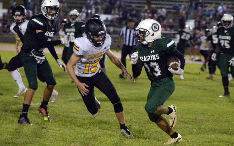 Kubasaki's Jayden Rivera looks to evade ASIJ defender Ammon Summers.