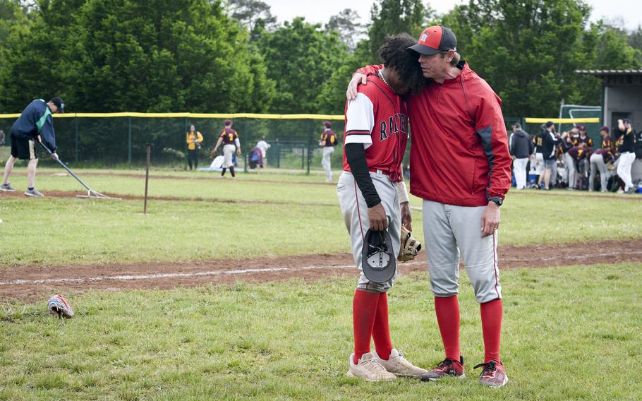 Kaiserslautern’s coach Justin Bates consoles pitcher Rueben Todman after coming close to upsetting powerhouse Stuttgart during the knockout rounds of the 2024 DODEA European baseball championships on May 23, 2024, at Southside Fitness Center on Ramstein Air Base, Germany.