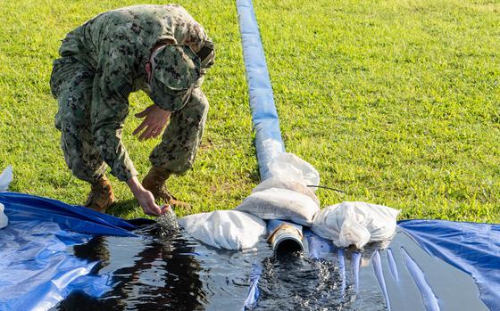 211220-N-FD567-1077 



PEARL CITY, Hawaii (Dec. 20, 2021) Capt. Randall Harmeyer, Joint Base Pearl Harbor-Hickam (JBPHH) Public Works Officer, inspects water flushed through Granulated Activated Carbon filters from the Waiawa Shaft water supply. Charcoal residue turns the clean water dark during the initial flush, a normal part of the filtering process. The JBPHH water quality recovery is a joint U.S. military initiative working closely with the State of Hawaii, Department of Health, Honolulu Board of Water Supply, U.S. government and independent organizations to restore a safe water delivery system to JBPHH military housing communities through testing, treatment, and repair. For detailed information, including available resources and locations, and news, go to www.navy.mil/jointbasewater. (U.S. Navy photo by Mass Communication Specialist Seaman Christopher Thomas)