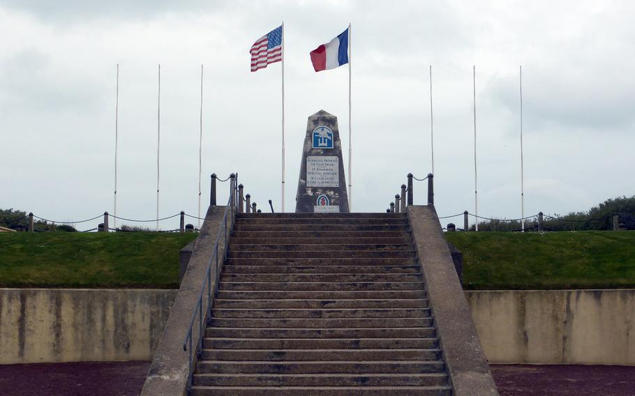 The monument to the 1st Engineer Special Service Brigade stands on top of a German bunker on Utah Beach.