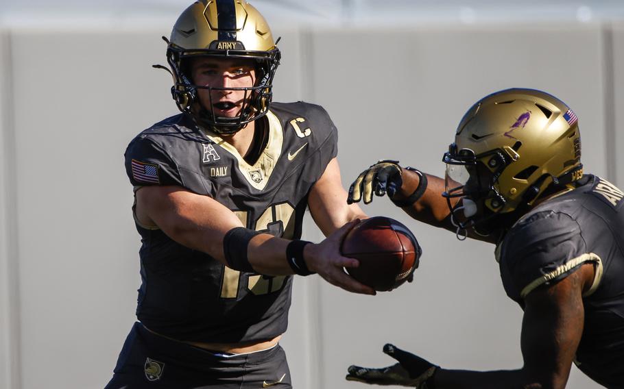 Army Black Knights quarterback Bryson Daily passes the ball to teammate, Oct. 19, 2024.