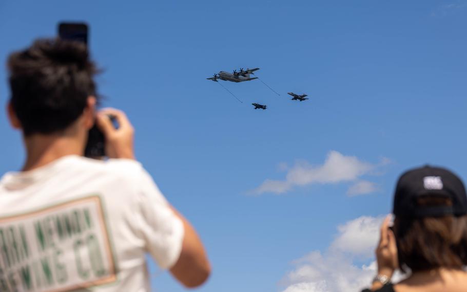 Spectators watch a KC-130J Hercules refuel in-air during the MCAS Cherry Point Air Show, Saturday, May 11, 2024, at MCAS Cherry Point, N.C. 