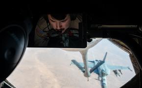 A U.S. Air Force 72nd Air Refueling Squadron boom operator refuels a U.S. Navy F/A-18E over the U.S. Central Command area of responsibility, Oct. 15, 2024. The F/A-18E is deployed to the U.S. 5th Fleet area of operations to help ensure maritime security and stability In the Middle East region. (U.S. Air Force photo)