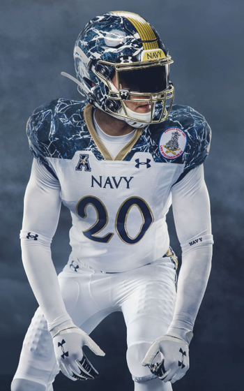 A Navy layer with a white jersey, white pants, blue and white helmet.