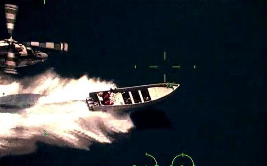 A boat tries to speed away from the Mexican navy in the Pacific Ocean.