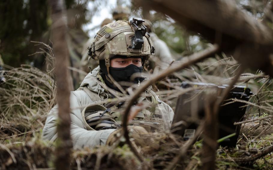 A U.S. soldier remotely pilots a drone.