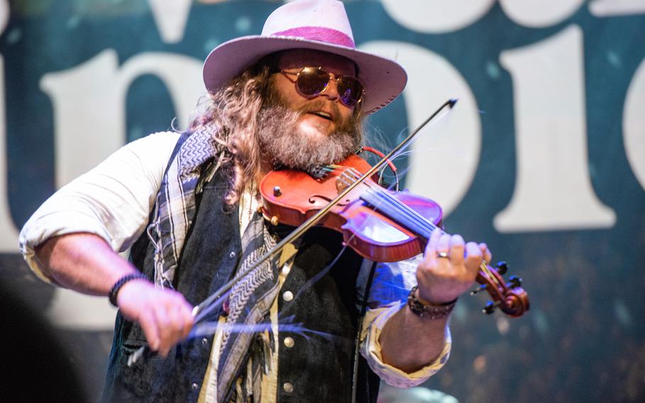 Donnie Reis, an Army veteran who served in Iraq in 2004, performs as half of the Nashville, Tenn.-based country duo War Hippies on March 9, 2023, during a concert at MadLife Stage & Studios in Woodstock, Ga., just north of Atlanta.