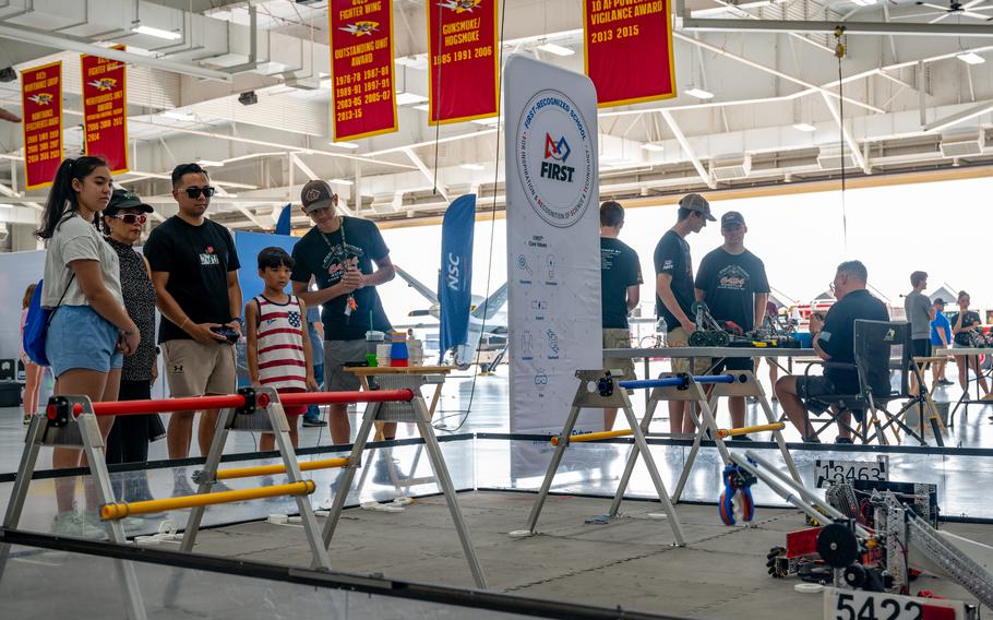 A family interacts with a robot at the 2024 Wings Over Whiteman STEM Fest at Whiteman Air Force Base, Mo., July 12, 2024. 