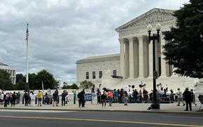 Spectators gather outside the Supreme Court in Washington on Monday, July 1, 2024.
