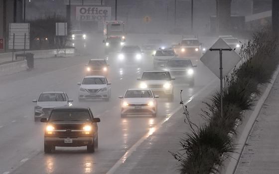 Vehicles make their way on a rain soaked highway in Dallas, Thursday, Dec. 26, 2024. (AP Photo/LM Otero)