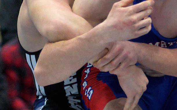 Jaden Workman of Hohenfels, left, beat Ramstein’s Evan Brooks for the 190-pound title at the high school 2022 Wrestling Tournament in Ramstein, Germany, Feb. 12, 2022.