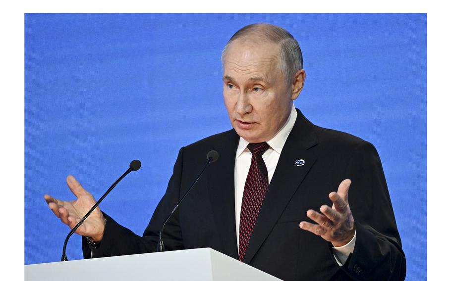 Russian President Vladimir Putin gestures while speaking at the annual meeting of the Valdai Discussion Club in the Black Sea resort of Sochi, Russia, on Oct. 5, 2023. 