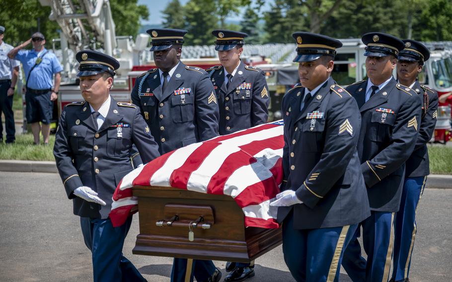 The Connecticut National Guard funeral honors team carries the casket of Tech Sgt. Kenneth McKeeman during his burial at the Connecticut State Veterans Cemetary in Middletown, Conn. June 7, 2024.