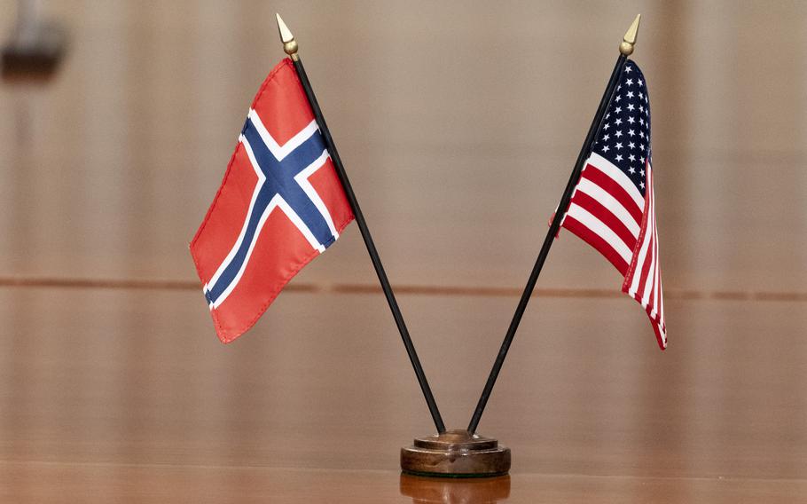 The Norway, left, and US flags are seen on the table at the Pentagon, on Sept. 20, 2022, in Washington.