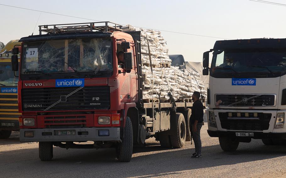 Trucks carrying humanitarian aid enter the Gaza Strip via the Rafah crossing with Egypt on Dec. 2, 2023. 