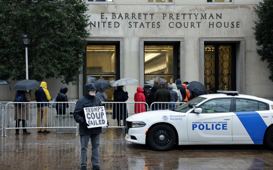 Bill Christen, who lives in the D.C. area, stands in front of the E. Barrett Prettyman U.S. Courthouse on Tuesday as former president Donald Trump attempts to quash his prosecution over efforts to overturn the 2020 presidential election.