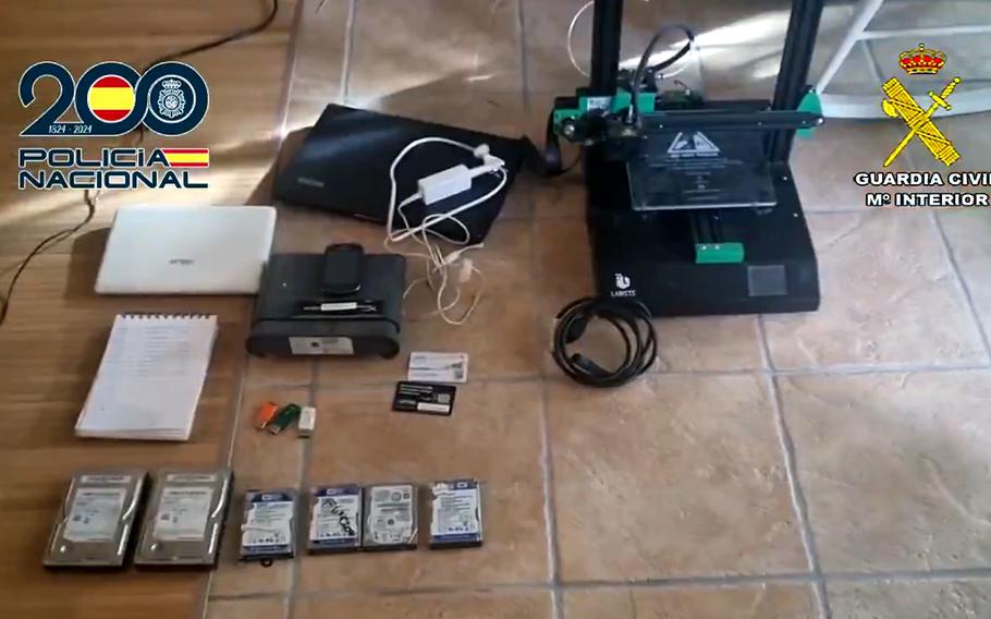 A screenshot from a Spanish national police video posted Feb. 5, 2025, shows computer equipment recovered 