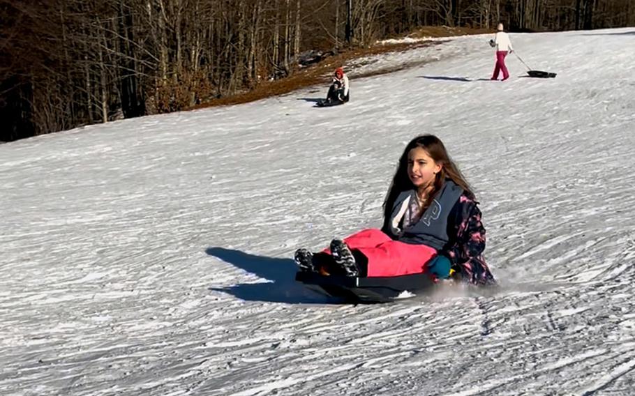 Liliana Erickson, 11, slides down a hill in Piancavallo, Italy.