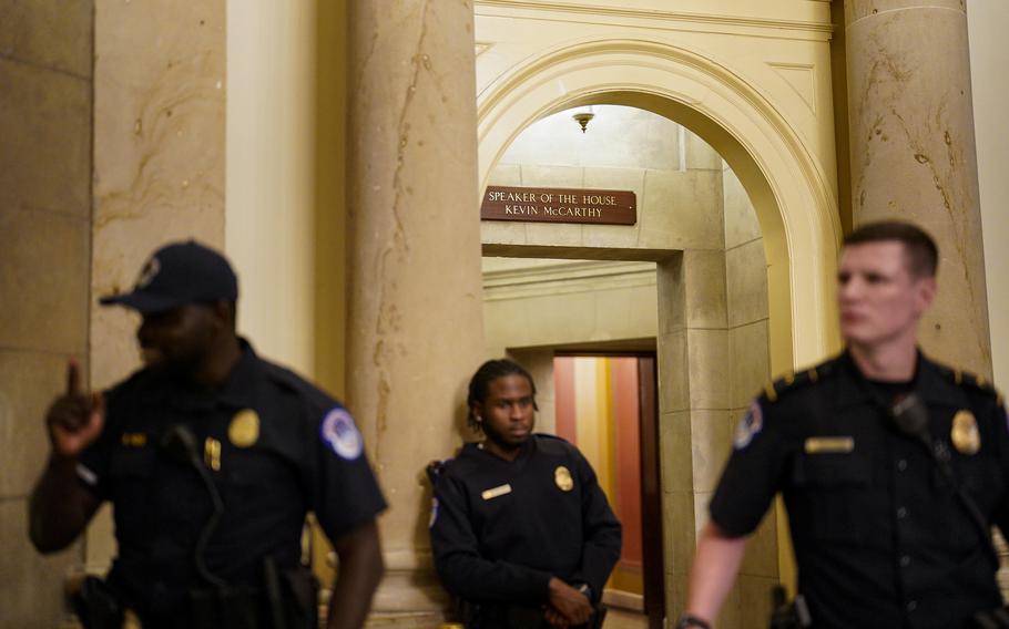 Capitol Police stand outside the speaker’s office, after the House voted to remove Rep. Kevin McCarthy (R-Calif.) from the speaker’s role at the U.S. Capitol on Wednesday. 