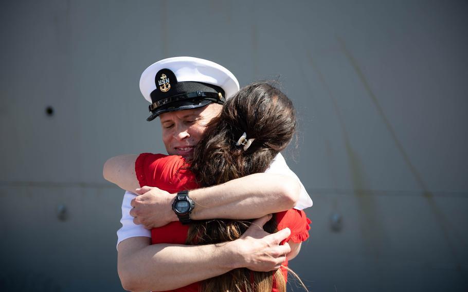 Chief Engineman Joshua Milburn of Anderson, Ind., embraces his girlfriend after returning home from deployment aboard the USS Carney on Sunday, May 19, 2024, at Naval Station Mayport, Fla. 