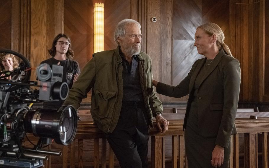 Director Clint Eastwood, left, and Toni Collette confer behind the scenes during production for “Juror #2.” “He’s so confident as a director, but not in a negative way. He’s just so present and allows it all to unfold,” she said. “I’ve never worked with anyone who’s so easygoing, to be honest.”