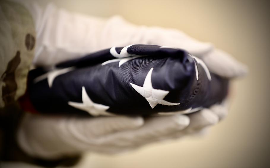 Army Reserve Sgt. 1st Class Thomas Wingfield, a maintenance noncommissioned officer, assigned to the 76th Operational Response Command headquarters in Salt Lake City, Utah, prepares to present an American flag to Col. Joel Miller (retired), former division chaplain, 76th ORC during Miller’s retirement ceremony Feb. 27. 