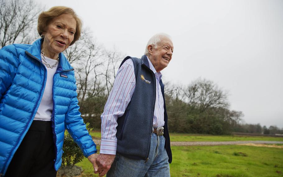 Jimmy Carter holds hand with wife Rosalynn in 2017.