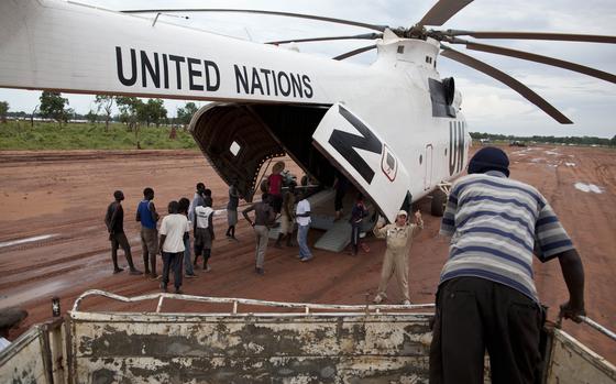 FILE - A World Food Programme (WFP) truck backs up to load food items from a recently landed UN helicopter, in Yida camp, South Sudan, Sept. 14, 2012. (AP Photo/Mackenzie Knowles-Coursin)