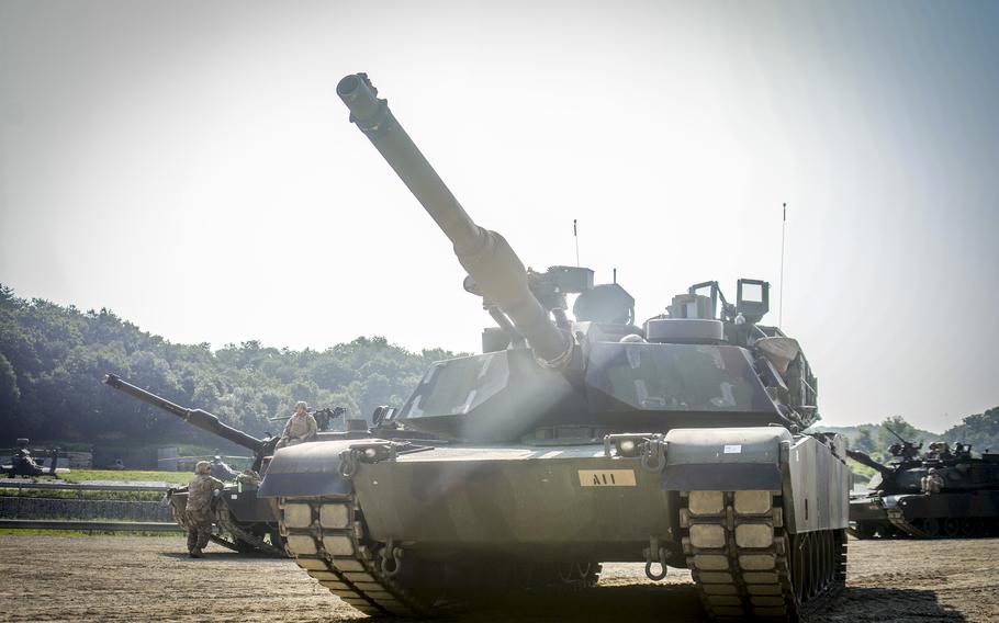 U.S. Army M1A2 Abrams tanks operated by the 1st Armored Brigade Combat Team, part of the 1st Armored Division from Fort Bliss, Texas, stand by for a drill at the Rodriguez Live Fire Complex in Pocheon, South Korea, Aug. 14, 2024.