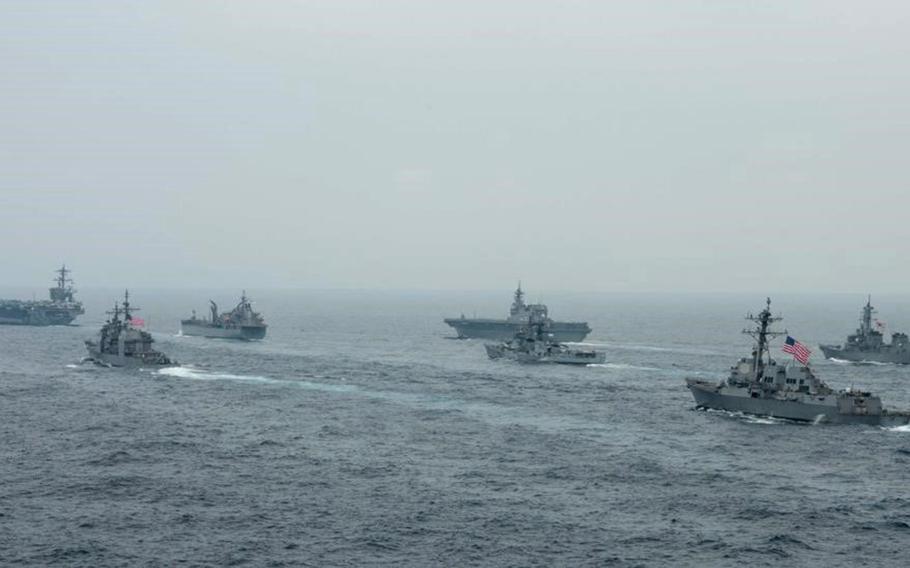The aircraft carrier USS Carl Vinson and guided-missile cruiser USS Lake Champlain are joined by warships from India, Australia and Japan during the annual Malabar exercise in the Bay of Bengal, Oct. 12, 2021. 