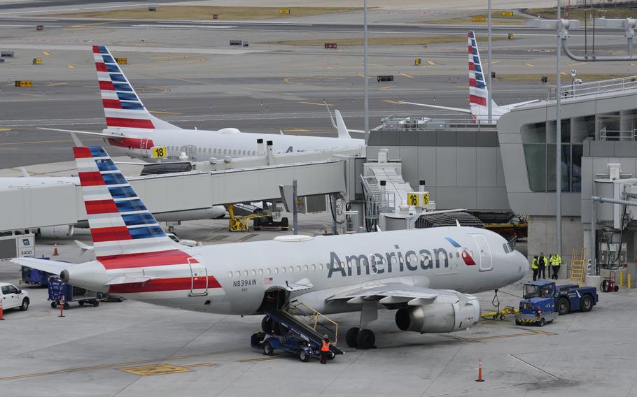 American Airlines planes sit on the tarmac at Terminal B at LaGuardia Airport in New York in January 2023. American, Delta, United and three other carriers, along with their industry trade group, sued the Transportation Department in a federal appeals court on Friday, saying that the agency is going beyond its authority by attempting “to regulate private business operations in a thriving marketplace.”