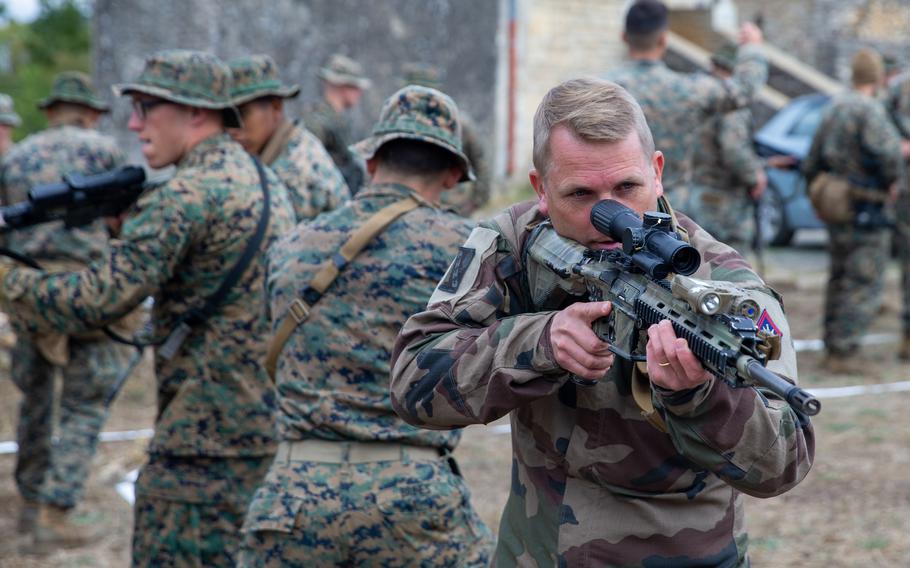 A French soldier trains with U.S. Marines during an exercise  in France in 2022. A majority of Americans and western Europeans said the bulk of the security burden in Europe should be carried by European nations, according to a poll released this month by the Institute for Global Affairs at the Eurasia Group.