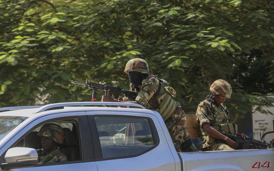 Haiti troops in a truck on patrol in Port-au-Prince.