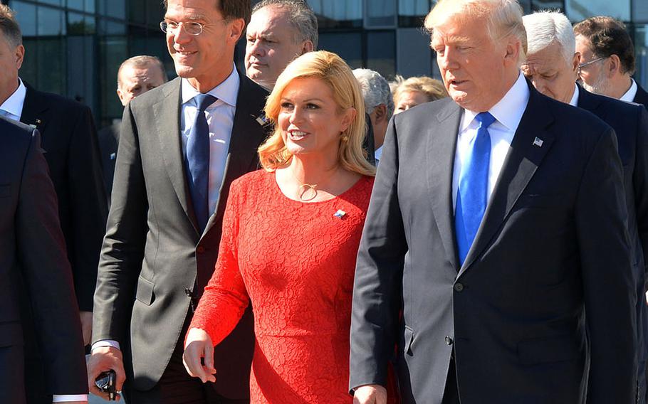 At the 2017 NATO summit in Brussels, President Donald Trump walks with Croatian President Kolinda Grabar-Kitarovic  and Dutch Prime Minister Mark Rutte. Rutte, now NATO's secretary-general, has a reputation for working well with Trump.