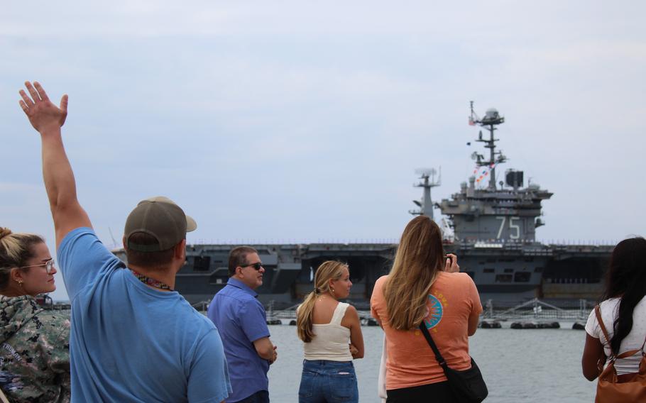 Dozens gather to see the USS Harry S. Truman as it departs