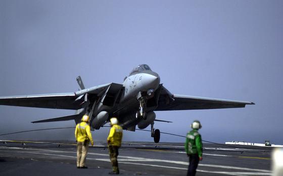 HED: Perfect landing, 2002

Somewhere in the Pacific Ocean, April 15, 2002: An F-14 Tomcat from VF-154 snags an arresting wire as it touches down on the flight deck of the USS Kitty Hawk. With this touchdown, several days of carrier qualifications followed.

Check out the story and see additional photos here: https://www.stripes.com/history/2023-01-23/kitty-hawk-crew-2002-8862937.html

META TAGS: U.S. Navy; aircraft carrier; USS Kitty Hawk Battle Group