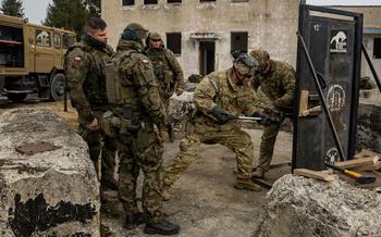 U.S Army paratroopers conduct mechanical breaching training with Polish soldiers.