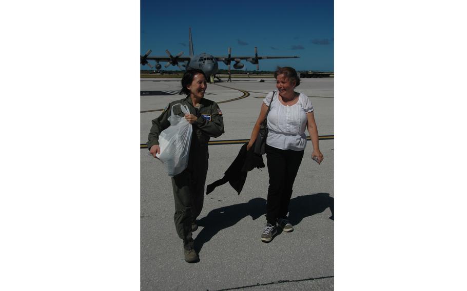 Col. Eveline Yao, left, commander of the 374th Medical Group at Yokota Air Base, Japan and Doria Rosen, U.S. Ambassador to the Federated States of Micronesia, walk off the flight line at Andersen Air Force Base