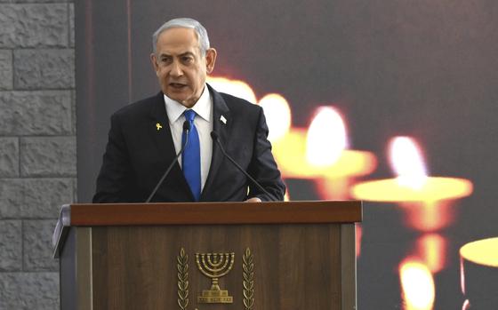 Israeli Prime Minister Benjamin Netanyahu speaks at a memorial ceremony for those killed by Hamas on Oct. 7, 2023, and those who fell in the "Iron Sword" war, at the Knesset, the Parliament, in Jerusalem, Monday, Oct. 28, 2024. (Debbie Hill, Pool Photo via AP)