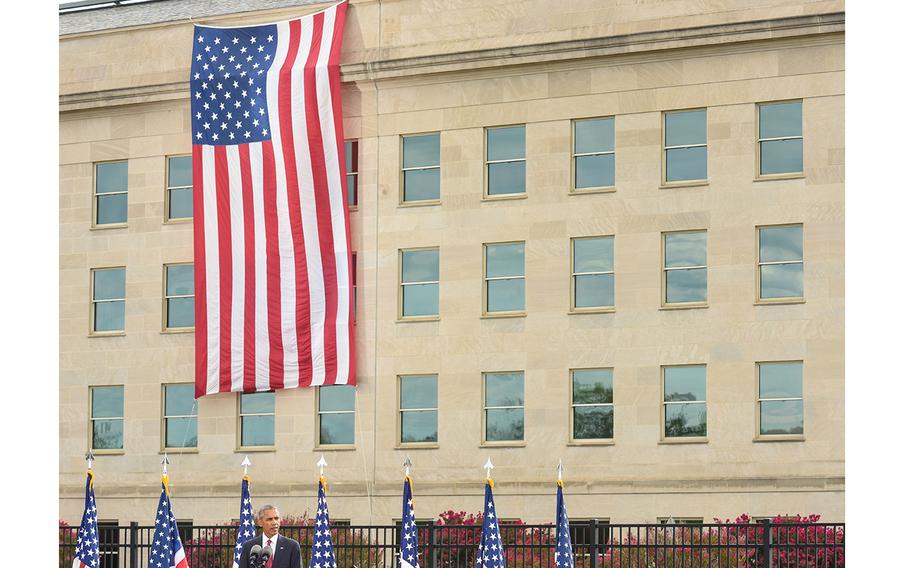 A flag hangs from the Pentagon during a memorial for 9/11