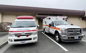 Japanese and American ambulances park outside the 374th Medical Group's urgent care entrance at Yokota Air Base, Japan, March 17, 2023.