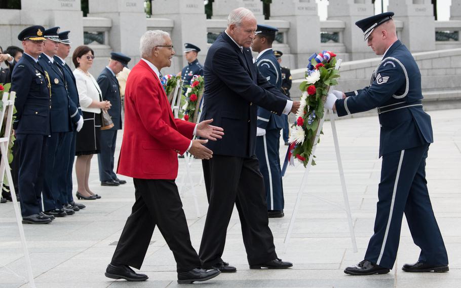 Tuskegee Airman Charles McGee placing a wreath at the National World War II Memorial