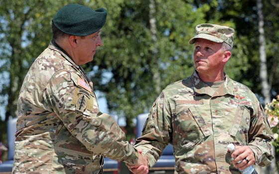 Incoming Special Operations Command Europe commander Brig. Gen. Joseph Lock, left, shakes hands with outgoing SOCEUR commander Maj. Gen. Steven Edwards following a change of command ceremony July 15, 2024, at Patch Barracks in Stuttgart, Germany.
