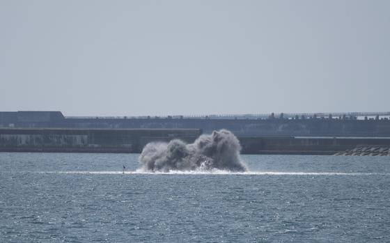 Japanese navy divers detonate two dozen shells believed to be from World War II at Naha Port, Okinawa, March 12, 2025.